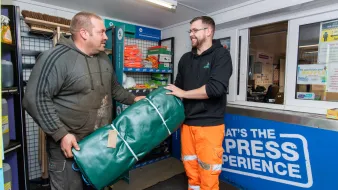 Express Asphalt customer in Express shop looking at commodity products.jpg