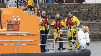 Lawrie Cerexhe, a coxswain on Holcim's UK's Glensdanda quarry boat service with her colleagues on a RNLI lifeboat where she also volunteers