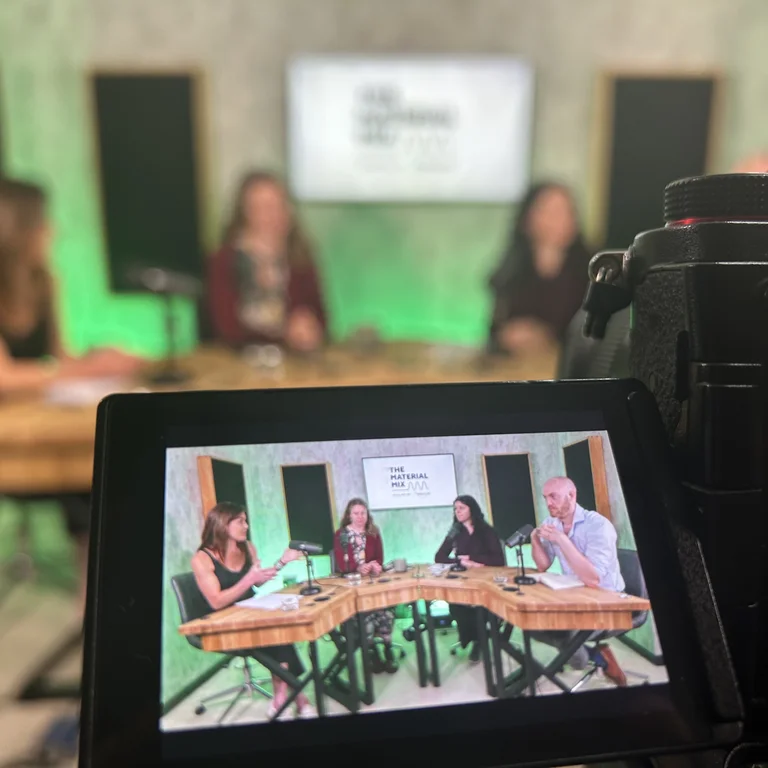 A close up of the camera filming guests in the studio of Holcim's Material Mix podcast