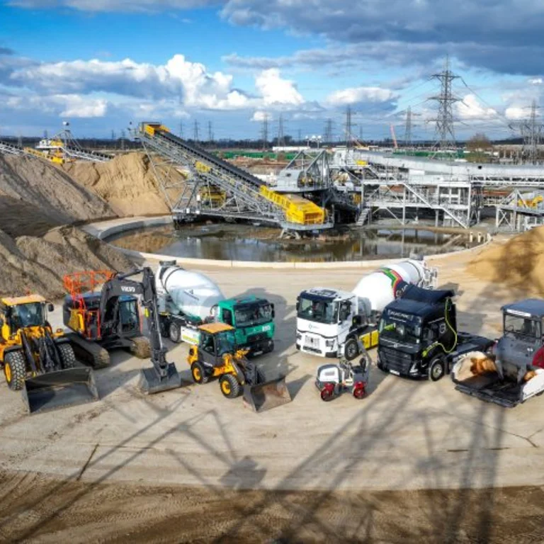 Electric vehicles from Holcim UK and Tarmac at the Tilbury site which is serving material supply to the Lower Thames Crossing project.