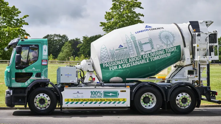 A side on view of an electrically powered concrete mixer with London Concrete branding on. It will be the first e-mixer to operate in London.