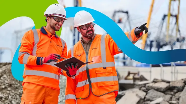 Swirl graphic with gradient behind two workers wearing PPE in an urban environment