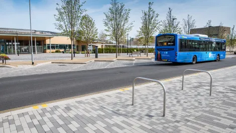 Charcon Eco Countryside Kerb with Stonemaster paving and a bus