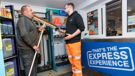 Express Asphalt shop customer buying broom commodity product.jpg