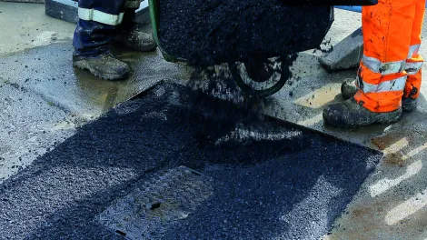 SuperTrench asphalt reinstatement laid round a manhole.jpg