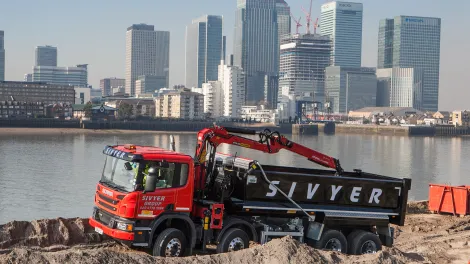 Sivyer truck driving in front of London skyline