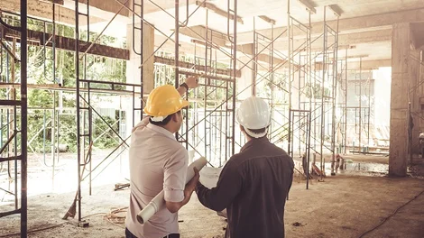 men in hard hats on a construction site