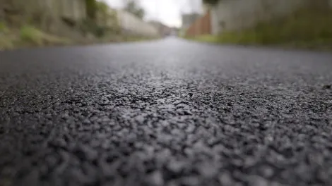 Extreme closeup of the new asphalt path laid at Waterhouses, Staffordshire