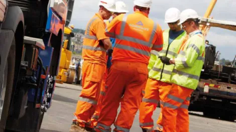 Quality Policy, men on site wearing high viz
