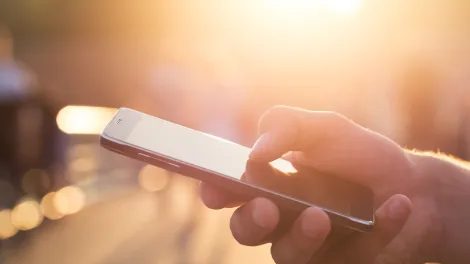 Aggregate Industries ePOD mobile phone in hand