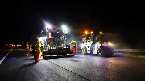 Road resurfacing equipment on the M5 motorway as part of night works carried out by Holcim UK