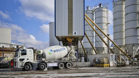 A Holcim UK mixer truck being filled with biochar coffee concrete at its Battersea Readymix plant in London