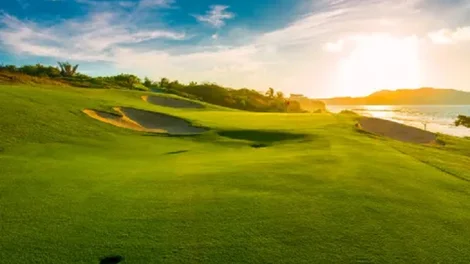 Golfing range green hill and sky