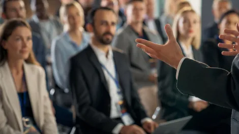 presentation being performed in front of a room of people
