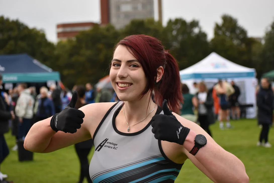 Danielle Dawson, Cement Technical Innovation Manager, in her running gear giving a thumbs up