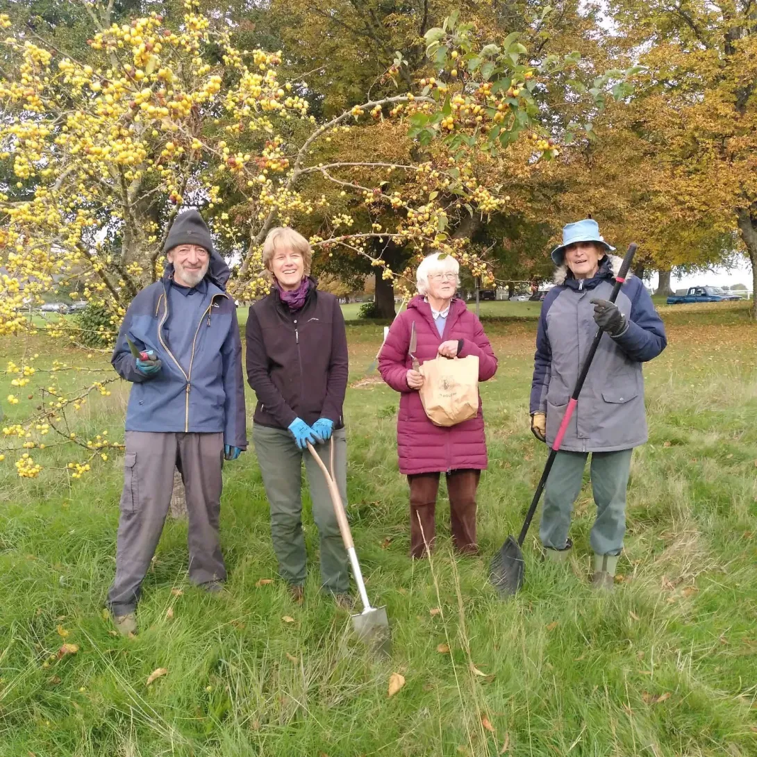 Community volunteers with gardening equipment ahead of planting spring flowering  bulbs donated by Holcim UK 