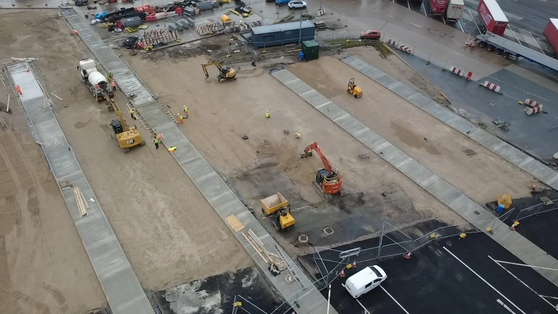 An aerial view of a concrete mixer truck delivering readmymix concrtete to Heysham Port from the Holcim Lancaster RMX plant