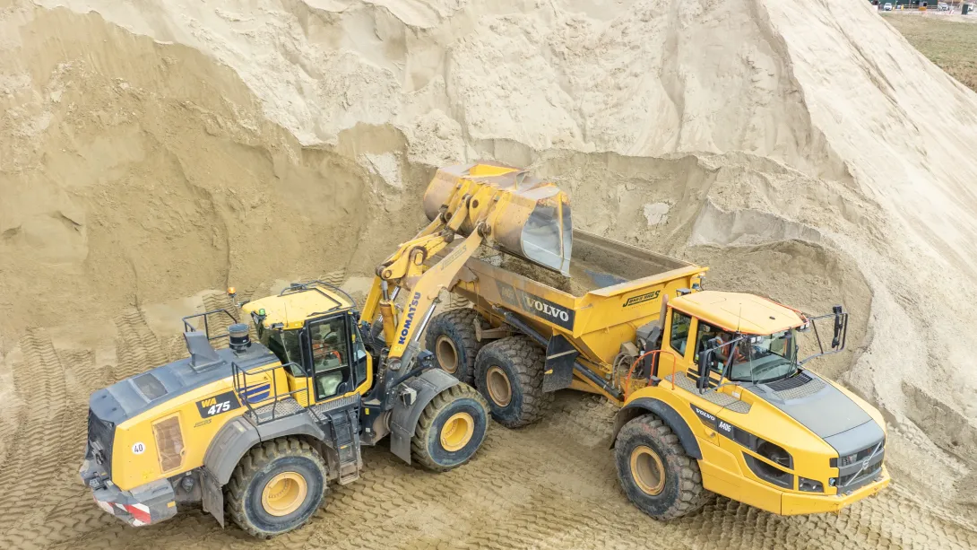 A loading shovel empties materials into a waiting dump truck. The materials will be used on the new Havant Thicket Reservoir near Portsmouth.
