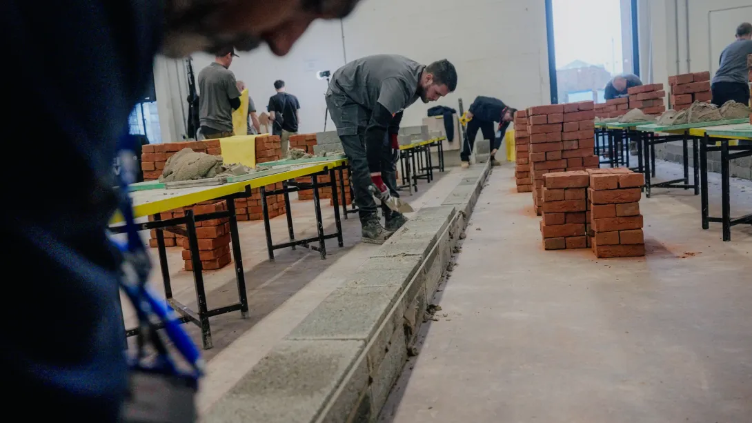 A contestant handling a Holcim block at a regional Super Trowel event. Holcim UK is one of the event sponsors.
