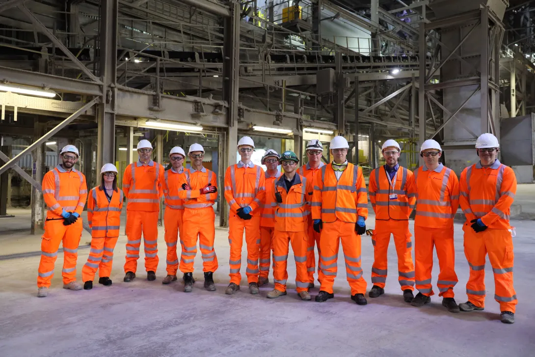 A group of Holcim Uk coleagues including CEO Lee Sleight in the Cauldon Cement Plant kiln building in high viz PPE
