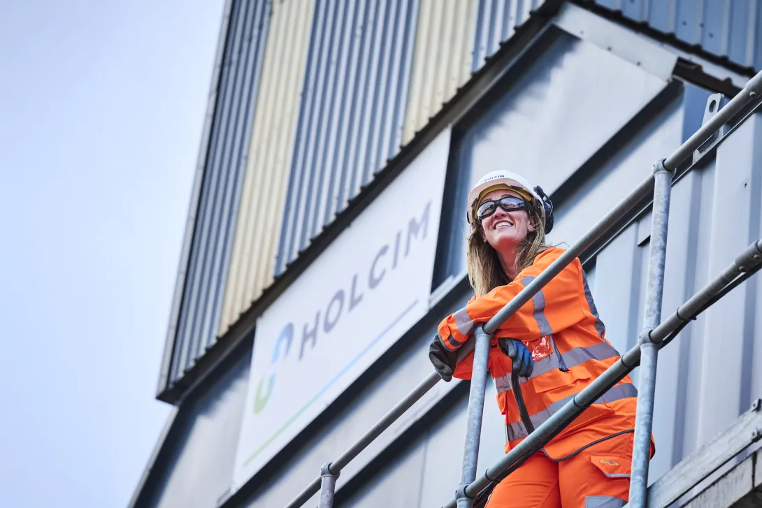 Lady in high viz PPE standing on a platform at Holcim's Coleshill readymix plant