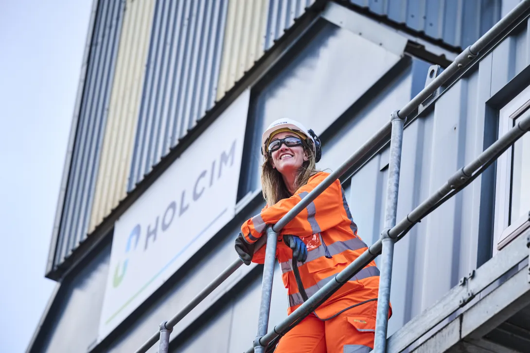 Emma Lewis in high viz PPE standing on a platform at Holcim's Coleshill readymix plant