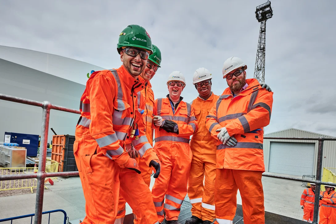 Members of Holcim UK's Tilbury site posing for a team phoot weatring full PPE.