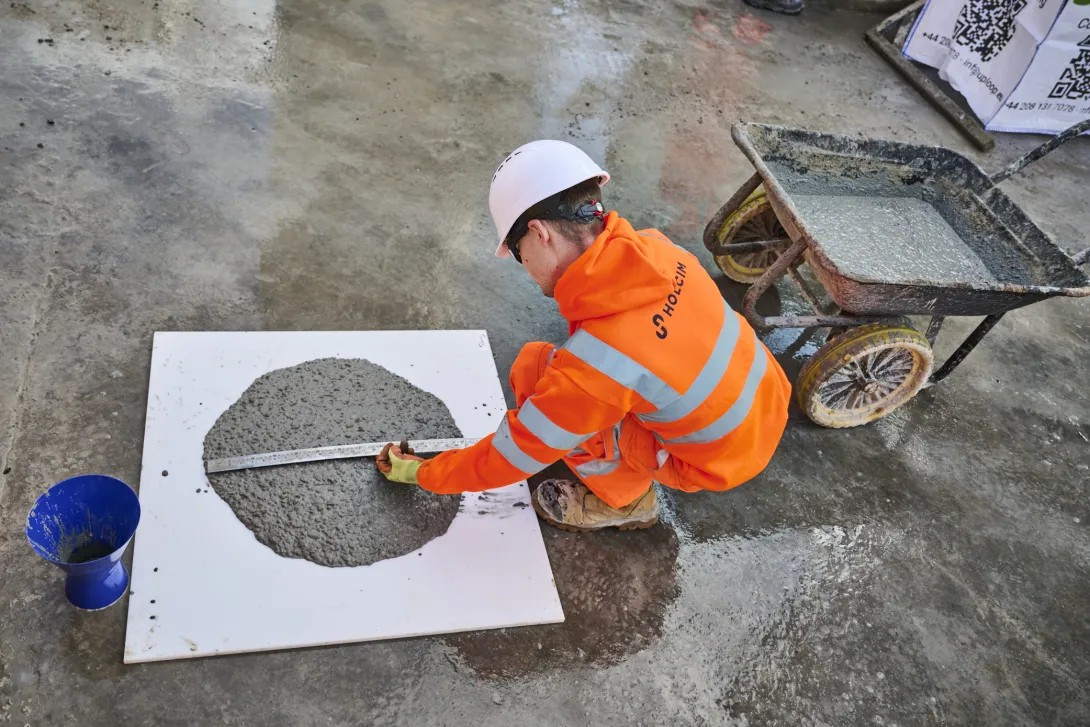 A Holcim UK technicain carries out test and measurements on the biochar coffee mix at its Battersea Reaymix plant.