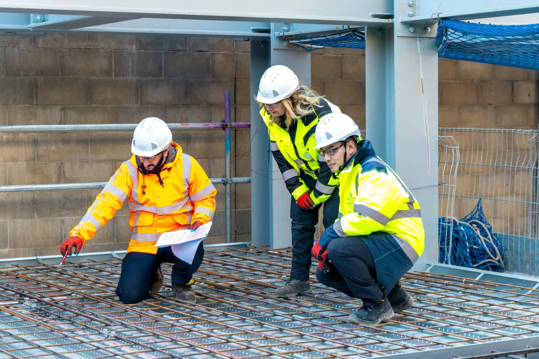 A team of three experts assess the pour area at Canary Wharf's Wood Wharf Theatre ahead of a pour of next gen concrete