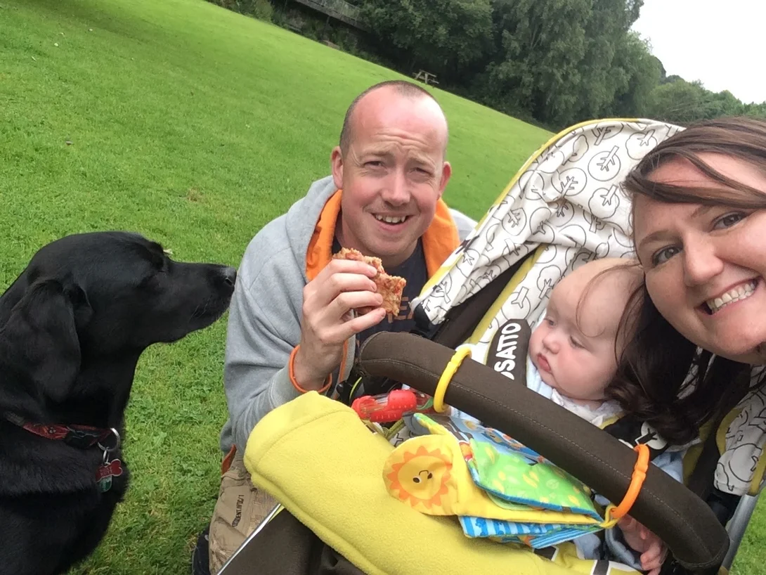 Rob Nutt with is family including his black labrador dog on a walk