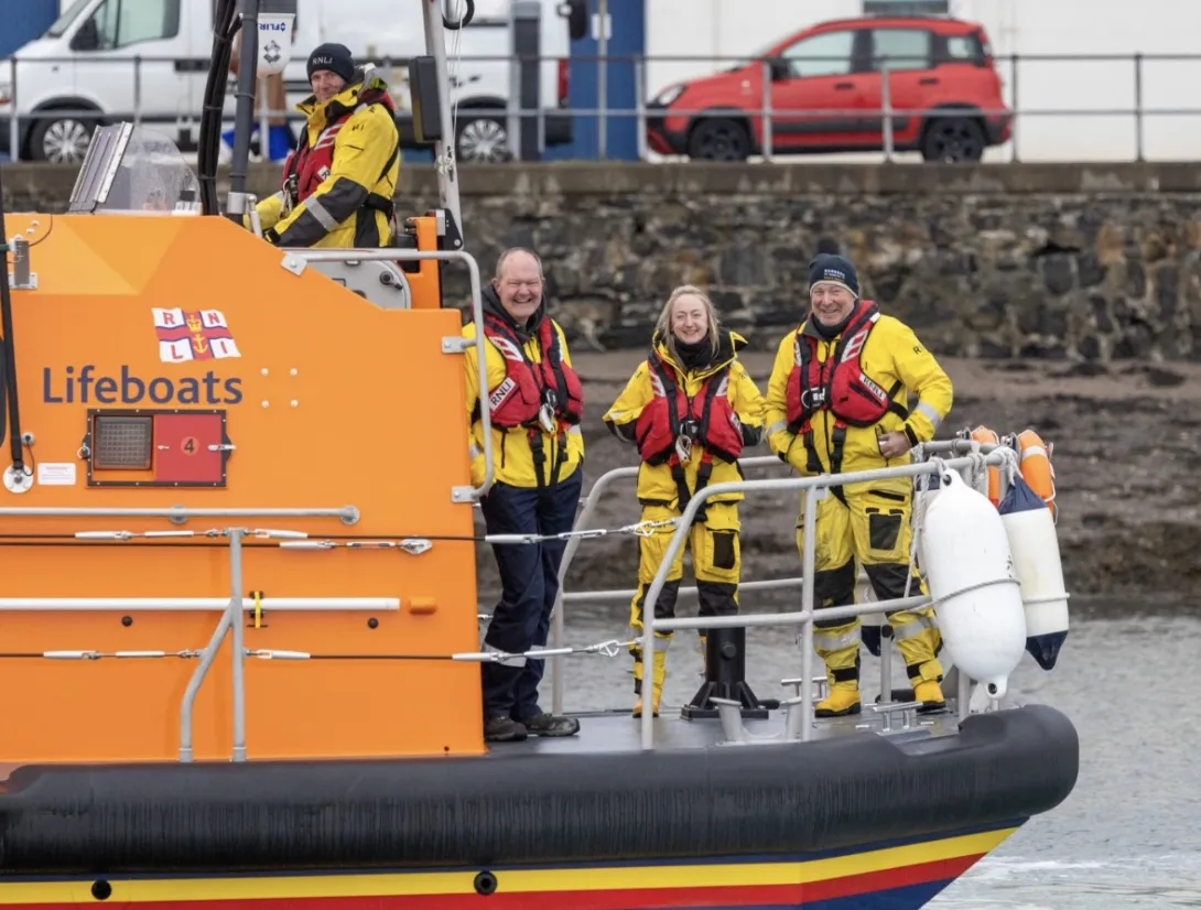 Lawrie Cerexhe, a coxswain on Holcim's UK's Glensdanda quarry boat service with her colleagues on a RNLI lifeboat where she also volunteers