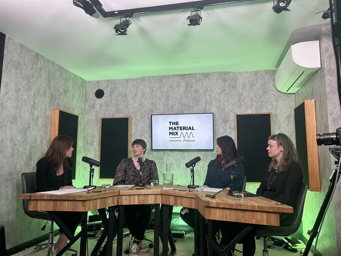 Members of the panel taking part in Holcim's The Material Mix podcast in a broadcasting studio.