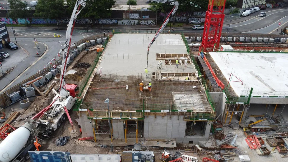 An aerial shot showiong low-carbon concrete being pumped onto site at Smithfield Lofts Birmingham