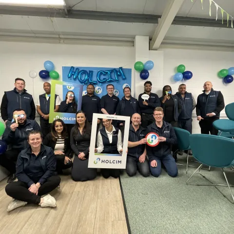 Kelly Lowe with colleagues during Holcim's rebrand in the UK