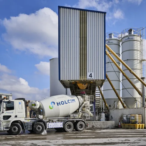A Holcim UK mixer truck being filled with biochar coffee concrete at its Battersea Readymix plant in London