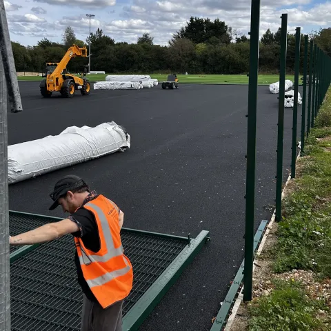 Work being carried out on a replacement synthetic pitch at Oasis Academy Croydon where Holcim's specialist sports sands were used.