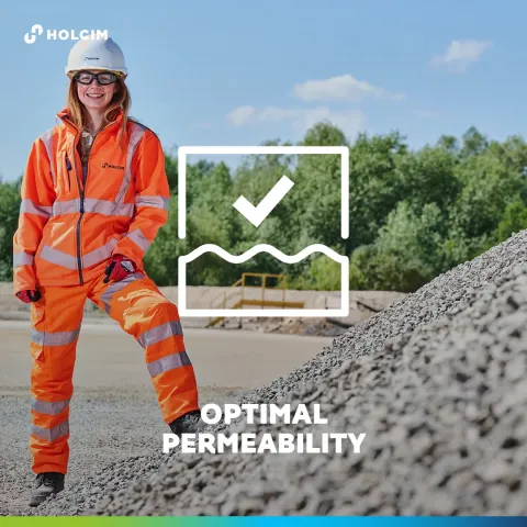 Woman standing on a pile of aggregates